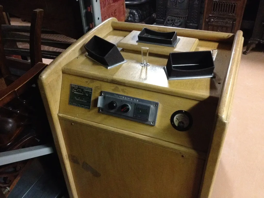 An Adrian shoe-fitting fluoroscope, with its three viewing ports and operator controls, at the Dufferin County Museum in Ontario