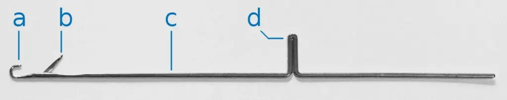 A knitting machine latch needle, showing the hook, the hinged latch, the shank and the butt
