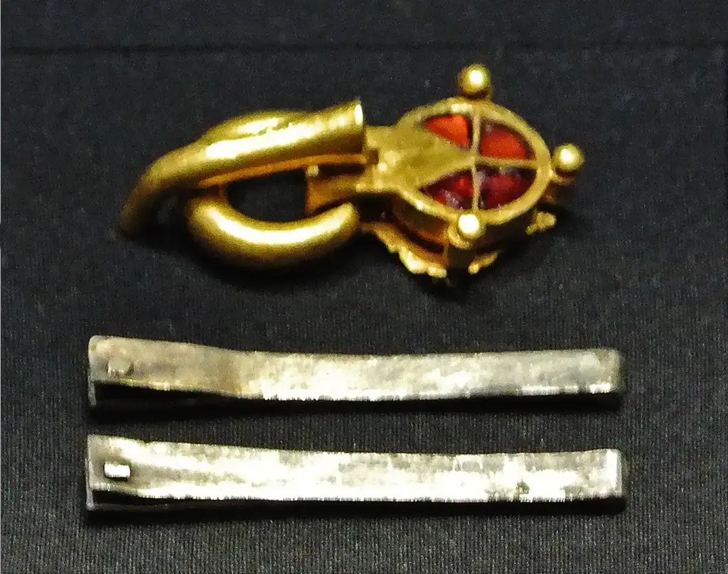 A gold and garnet buckle and two silver strap ends from the footwear in the Treasure of Untersiebenbrunn, from around 430, at the Kunsthistorisches Museum in Vienna