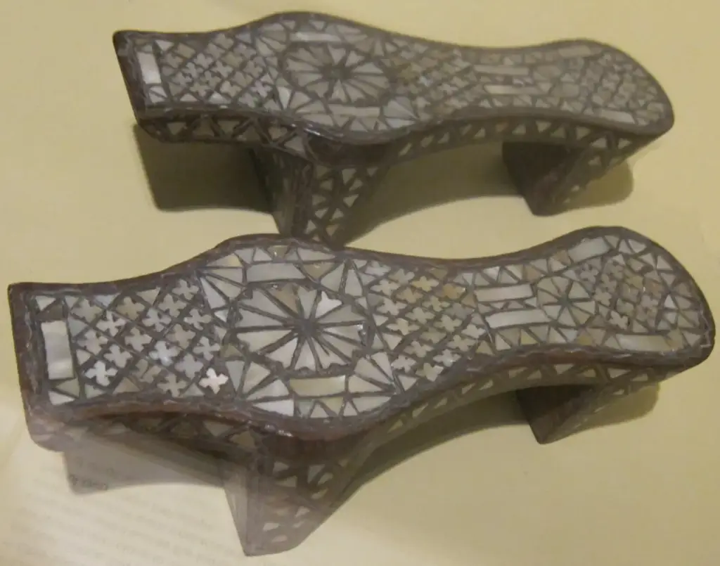 A pair of 18th-century Syrian bath clogs made of wood inlaid with mother-of-pearl, raised on tall supports